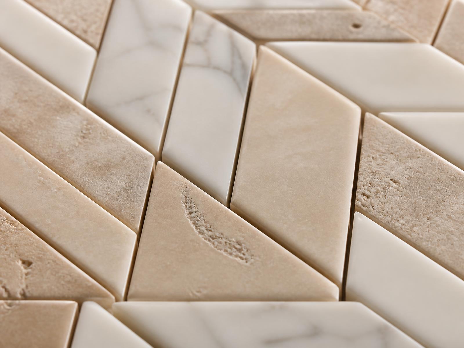 Close-up of ceramic and marble tile detail with hairline grout joints